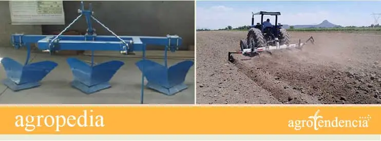 Cultivo de maíz - Tractor pasando una rastra para preparar el suelo para sembrar maíz