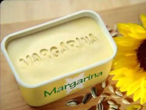 frasco con margarina con semillas y flor de girasol